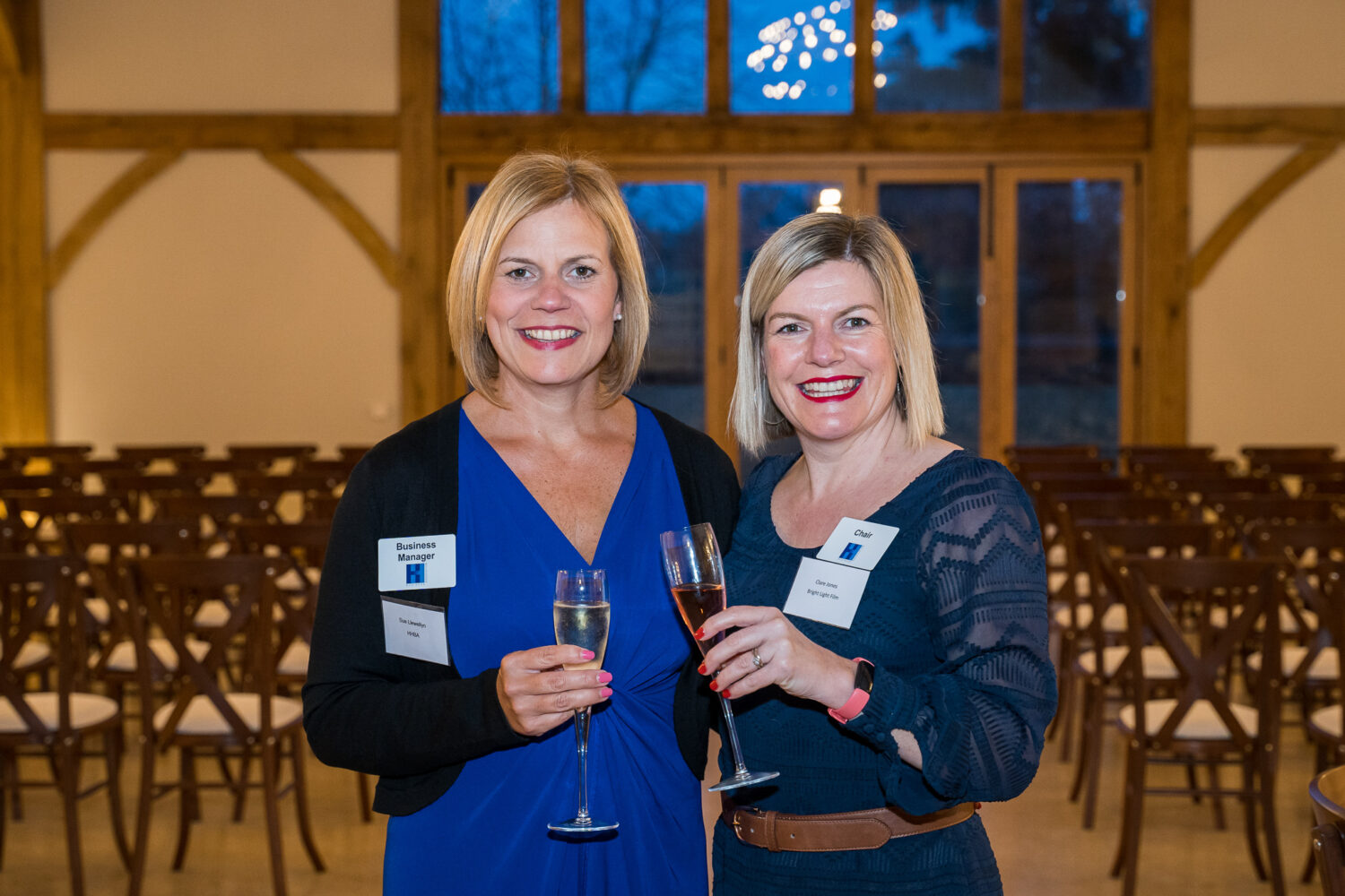 Two businesswomen photographed at a networking event at Greentrees Estate